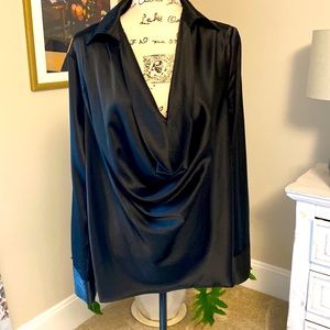 Black satin pullover blouse in oversized style with covered button wrists